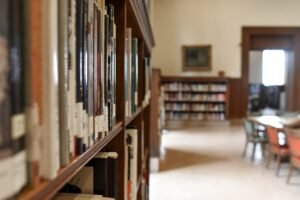 selective focus photography of bookshelf with books